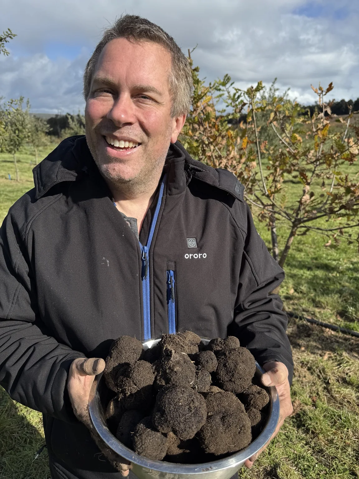 Freshly harvested black truffles held in a bowl at Haiku Hills