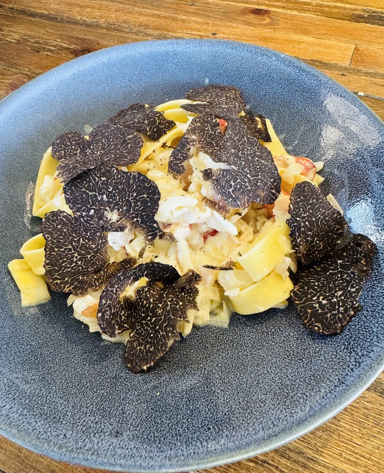 Fresh black truffle shaved generously over pasta